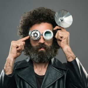 Photo of a man wearing strange mechanical glasses.