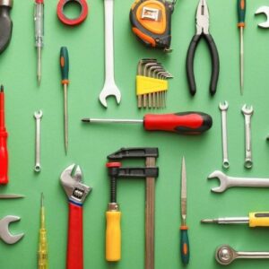 Knolling-style photo of various tools against a green background.